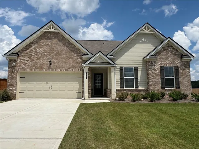 Brick and siding exterior with decorative gable accents