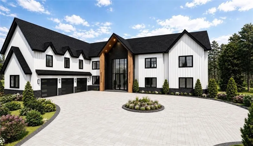 Modern farmhouse exterior featuring white vertical siding and black trim