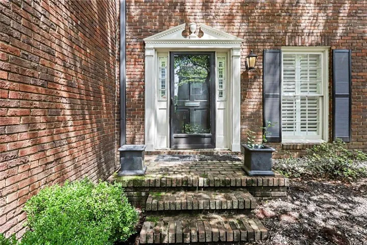 Front door is very private and overlooks green area