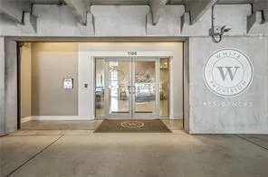 Concrete exterior with exposed beam ceiling