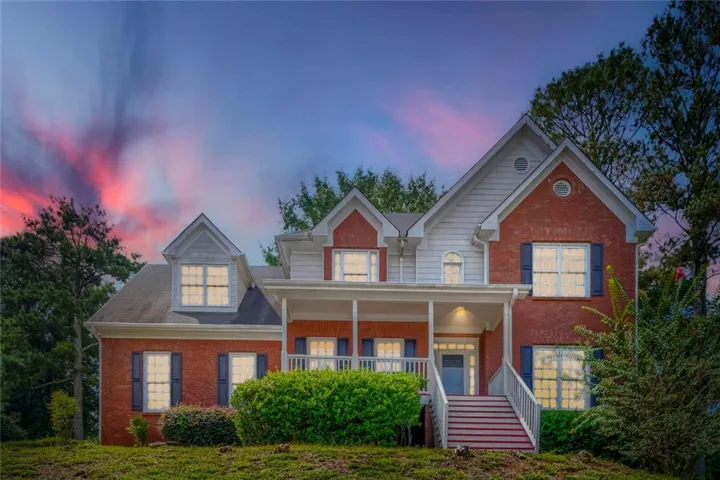 Brick with white siding accents