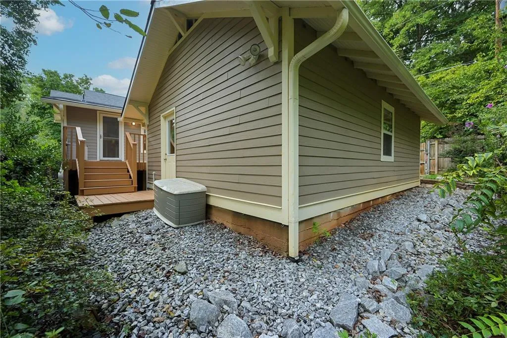 View of home's exterior featuring a wooden deck