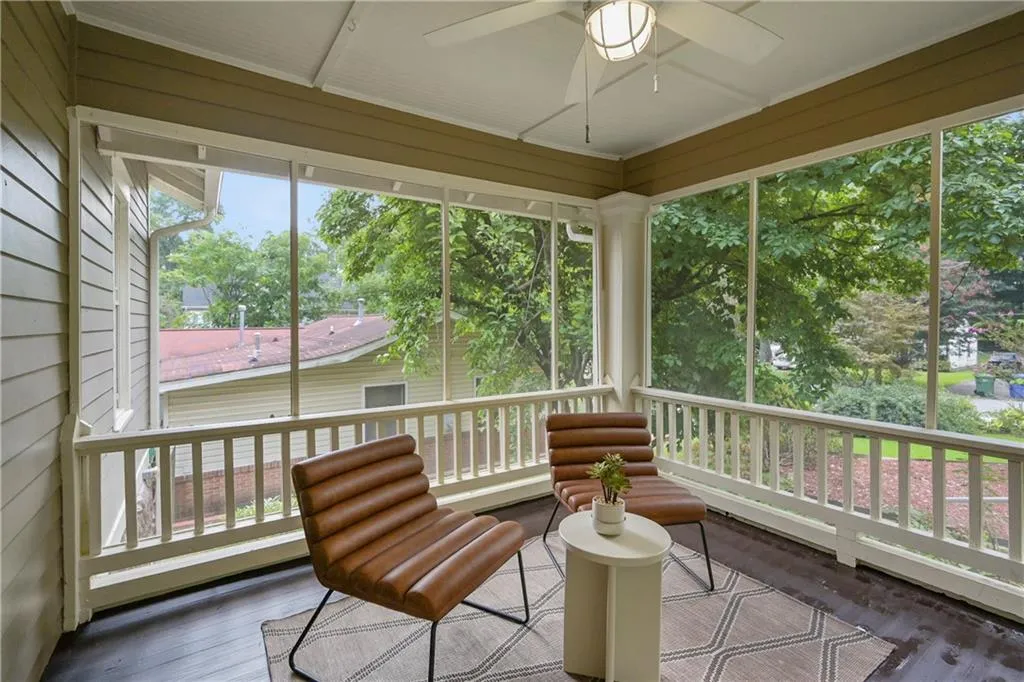 Sunroom / solarium featuring wood finished floors