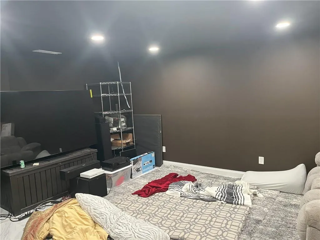 Bedroom featuring baseboards and recessed lighting