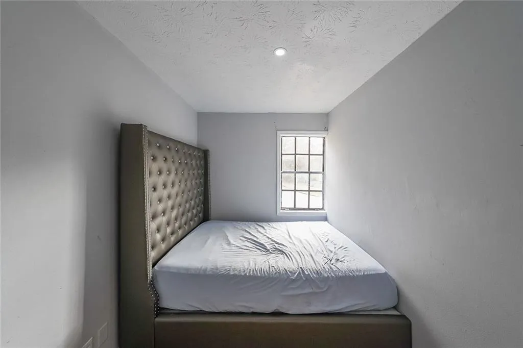 Bedroom featuring a textured ceiling