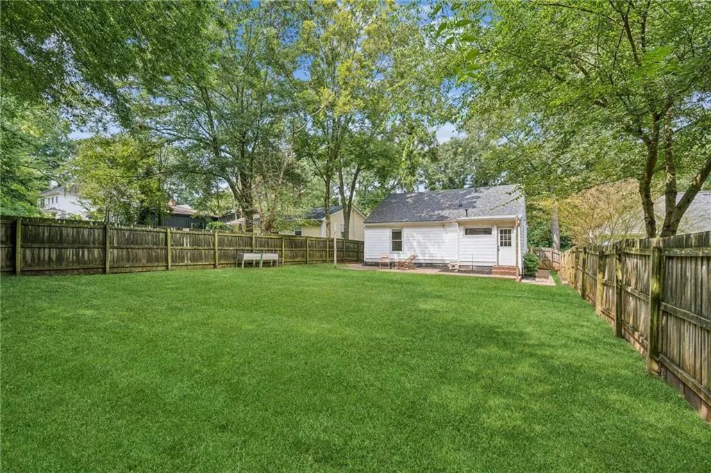 Fenced backyard featuring a patio