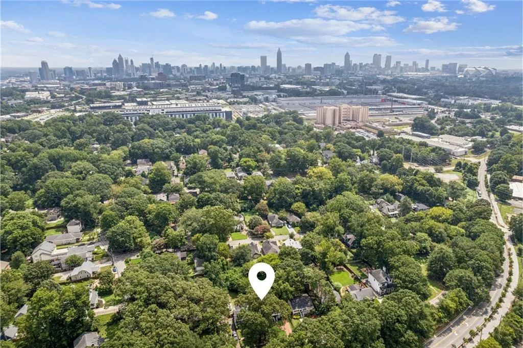 Aerial view of city skyline and a tree filled landscape
