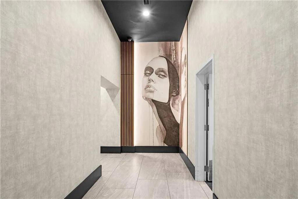 Corridor featuring light tile patterned flooring