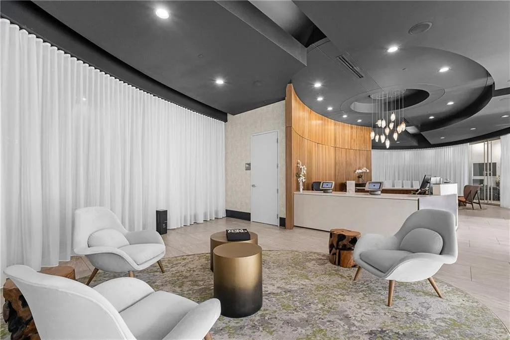 Reception area featuring visible vents and an inviting chandelier