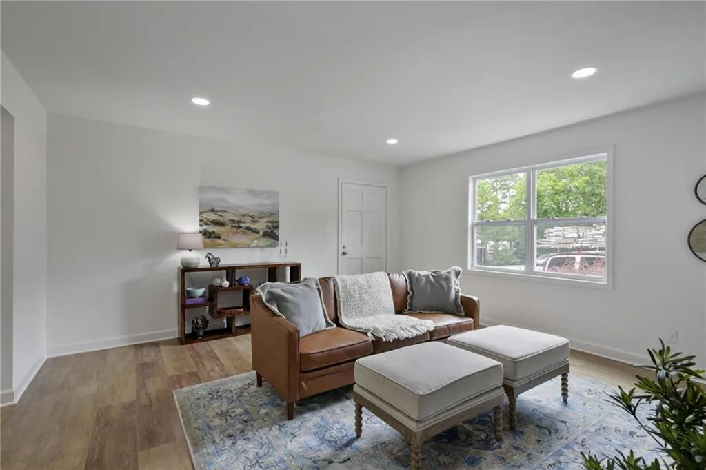 Living room with light hardwood / wood-style floors