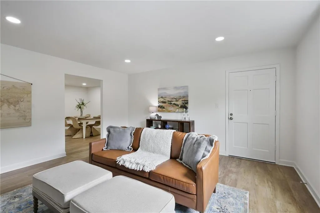 Living room with light wood-type flooring