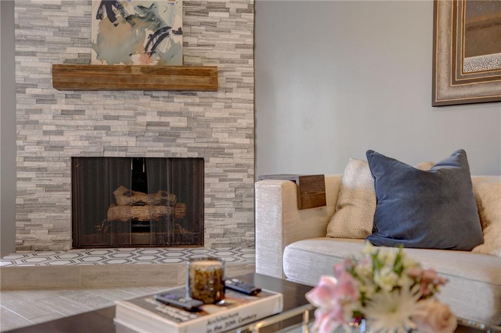 Living room with a stone fireplace