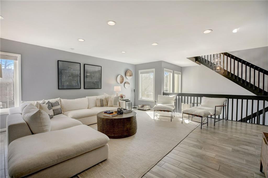 Living room with light wood-type flooring
