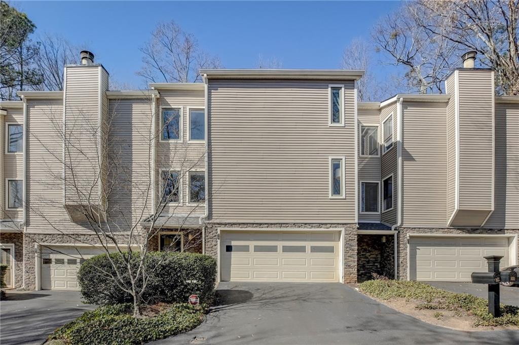 View of front facade featuring a garage