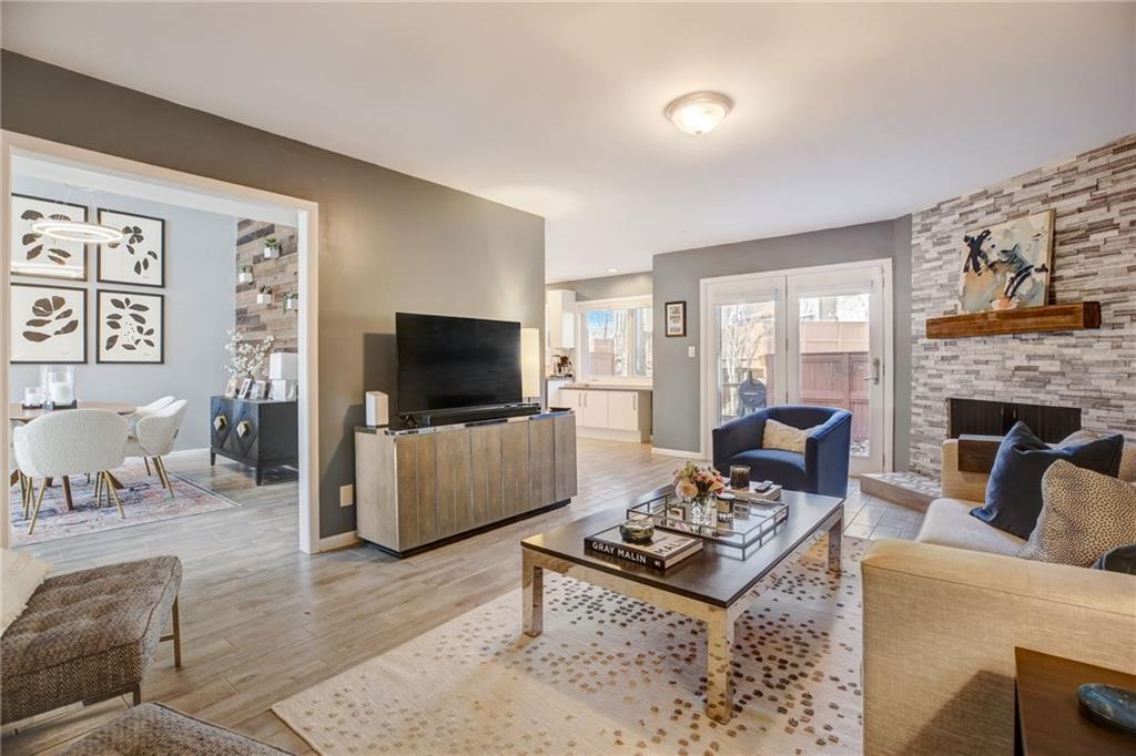 Living room featuring a fireplace and light hardwood / wood-style floors