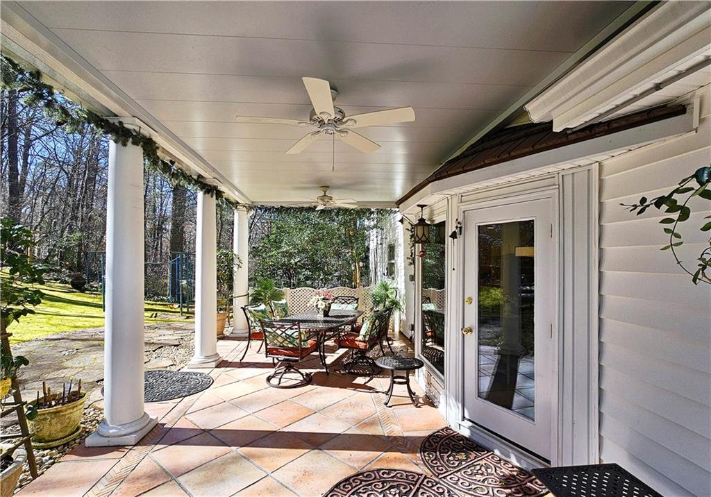 View of patio featuring ceiling fan