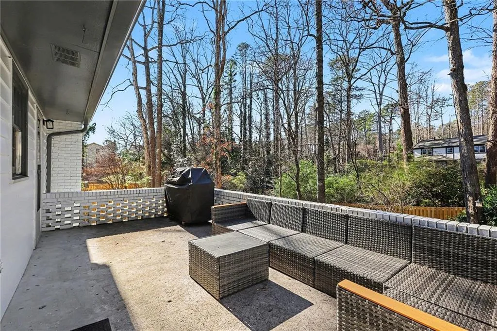 View of patio featuring a grill and outdoor seating