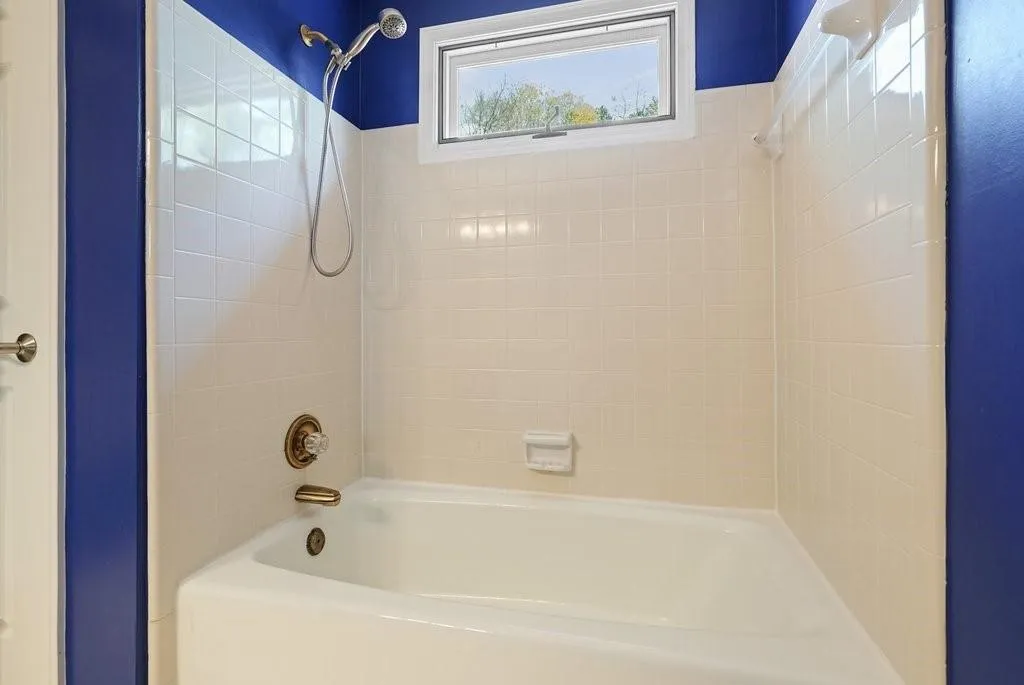 Bathroom featuring shower / washtub combination