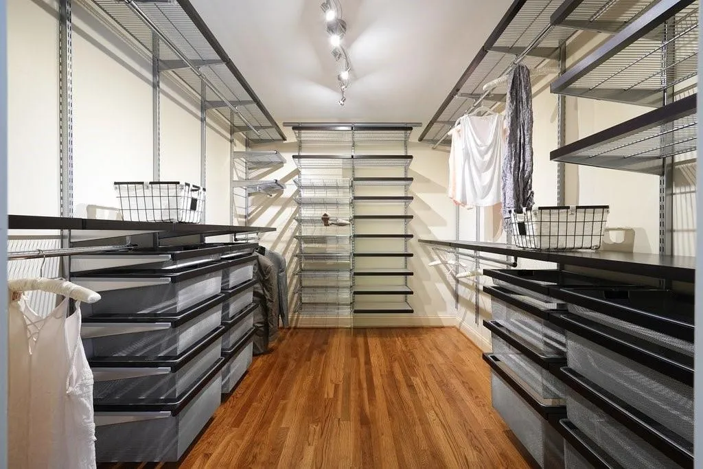 Walk in closet featuring wood finished floors