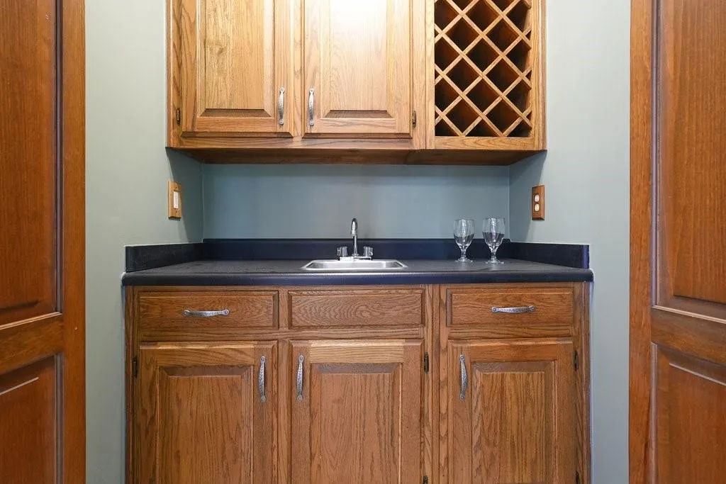 Bar featuring indoor wet bar and a sink