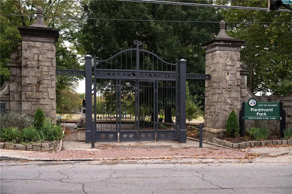Gate featuring view of wooded area