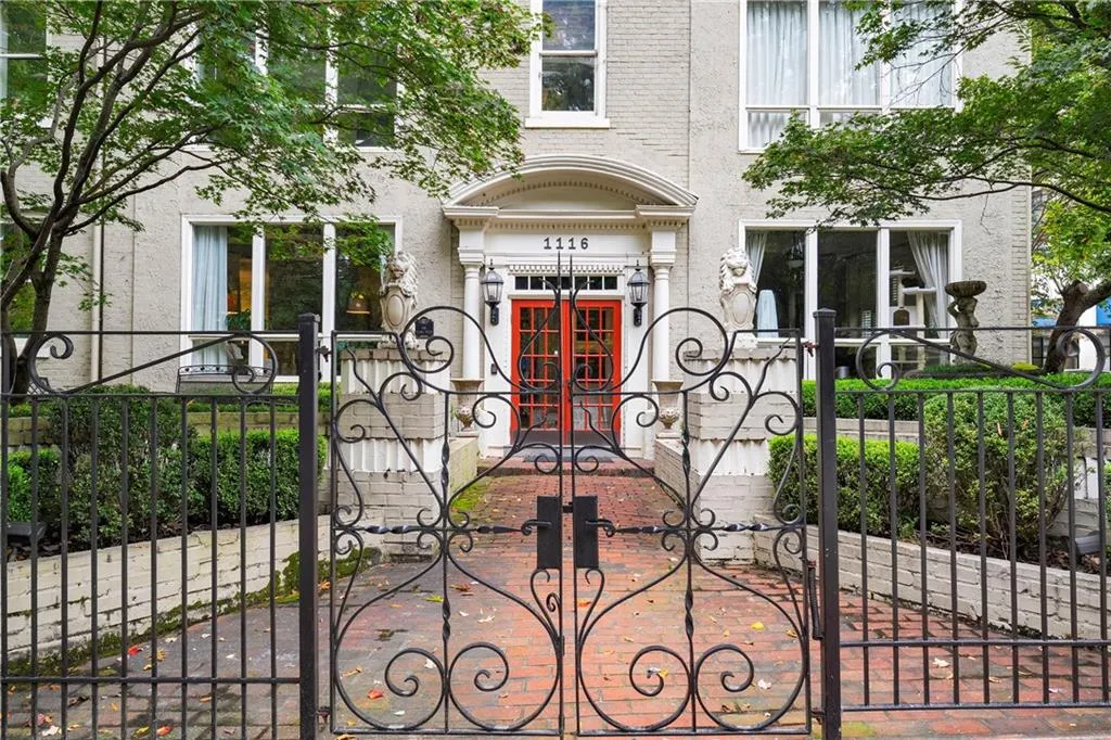 Gate featuring a fenced front yard