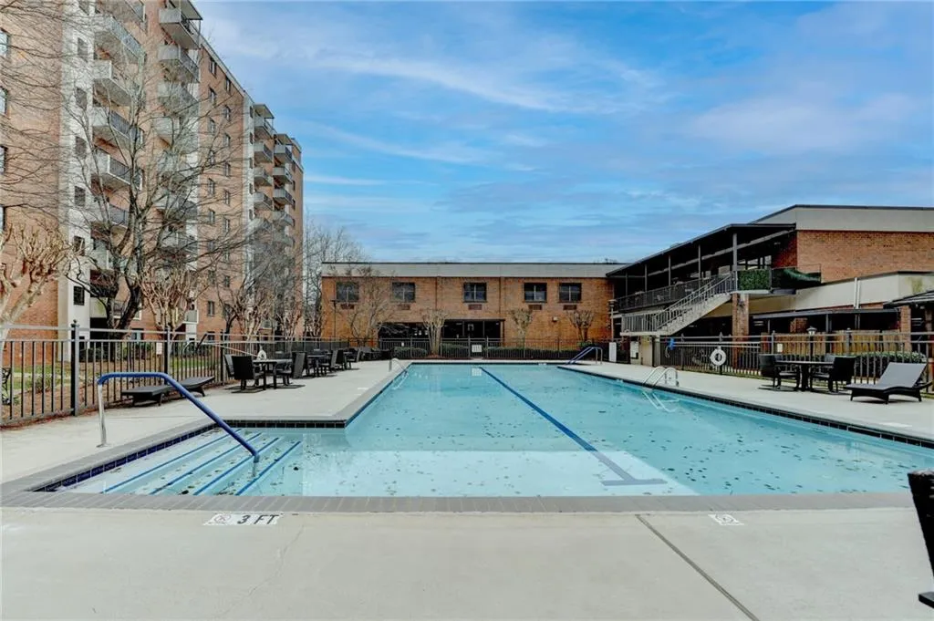 Community pool with a patio area