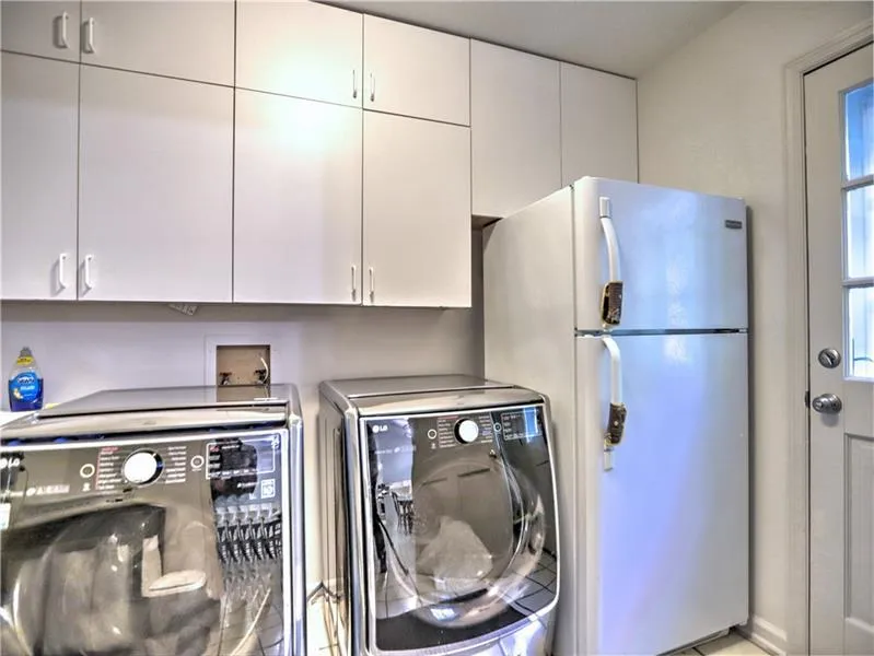Clothes washing area with washer and clothes dryer