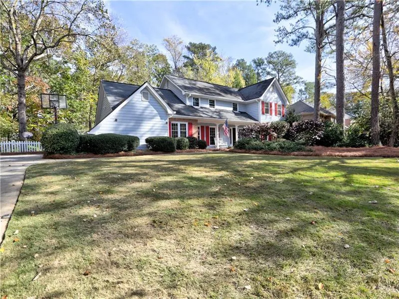View of property with a front lawn