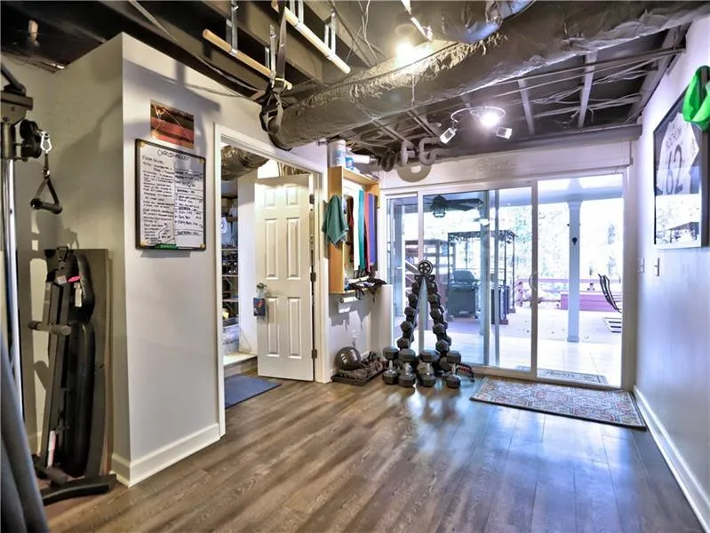 Workout room with hardwood / wood-style flooring