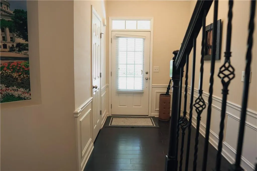 Doorway to outside featuring dark hardwood / wood-style flooring