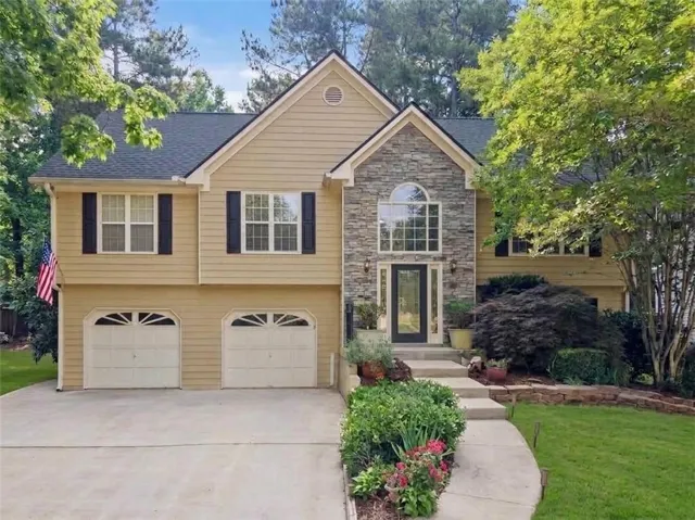 Deep garage with storage & workshop. side entry door fro convenience.