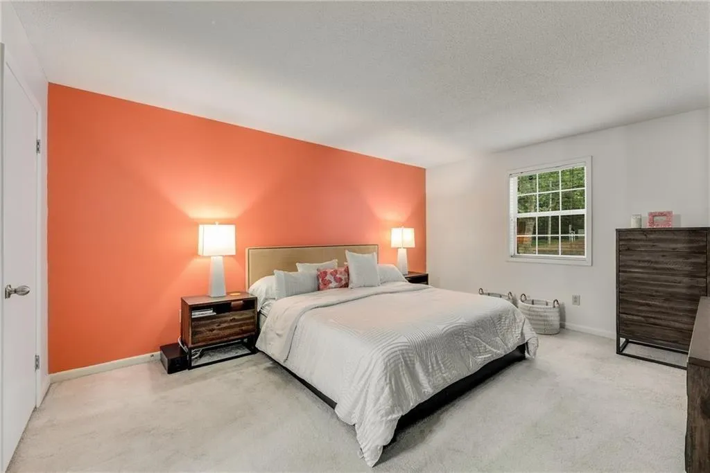 Bedroom with carpet floors and a textured ceiling