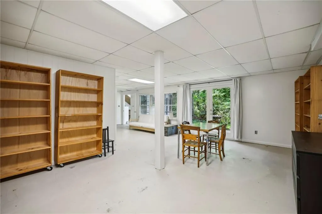 Basement with exterior exit to backyard and patio