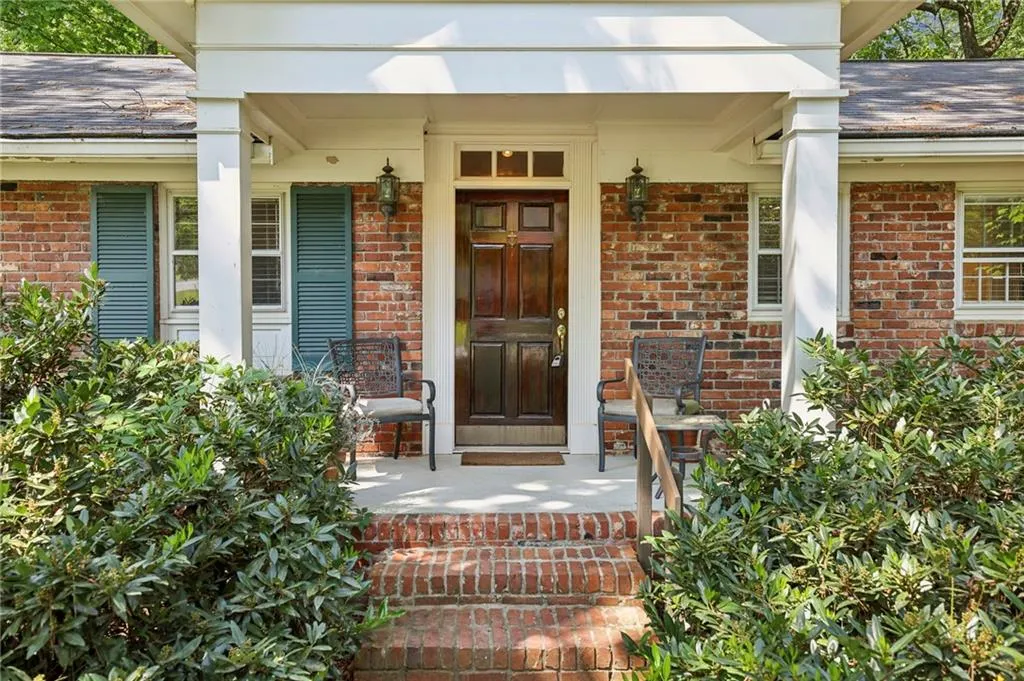 Doorway to property featuring a porch