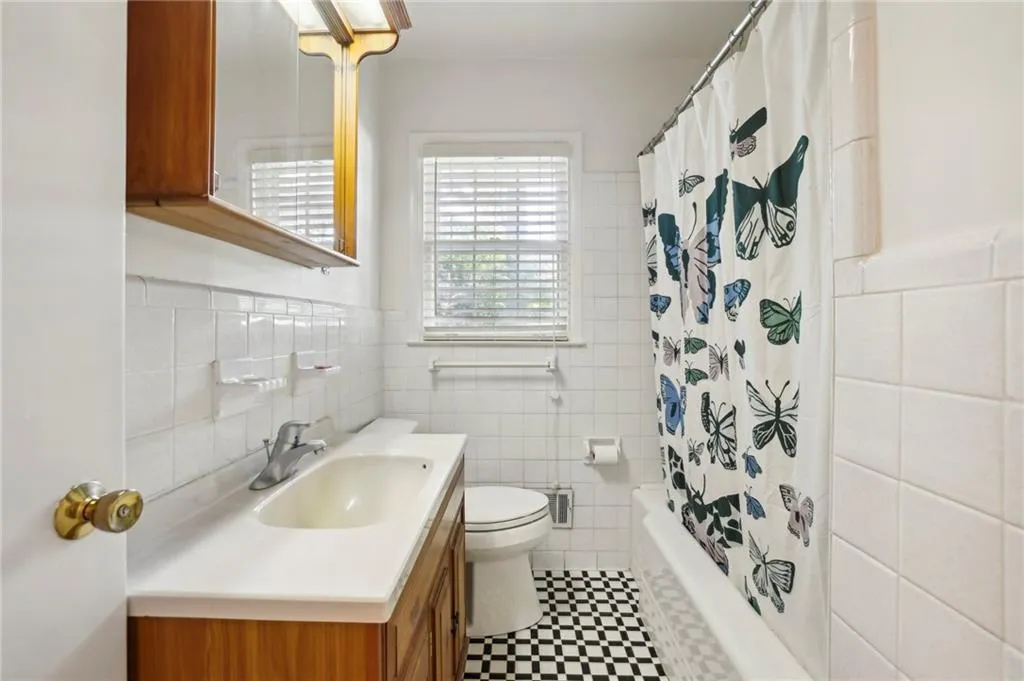 Full bathroom with tile walls and tile walls
