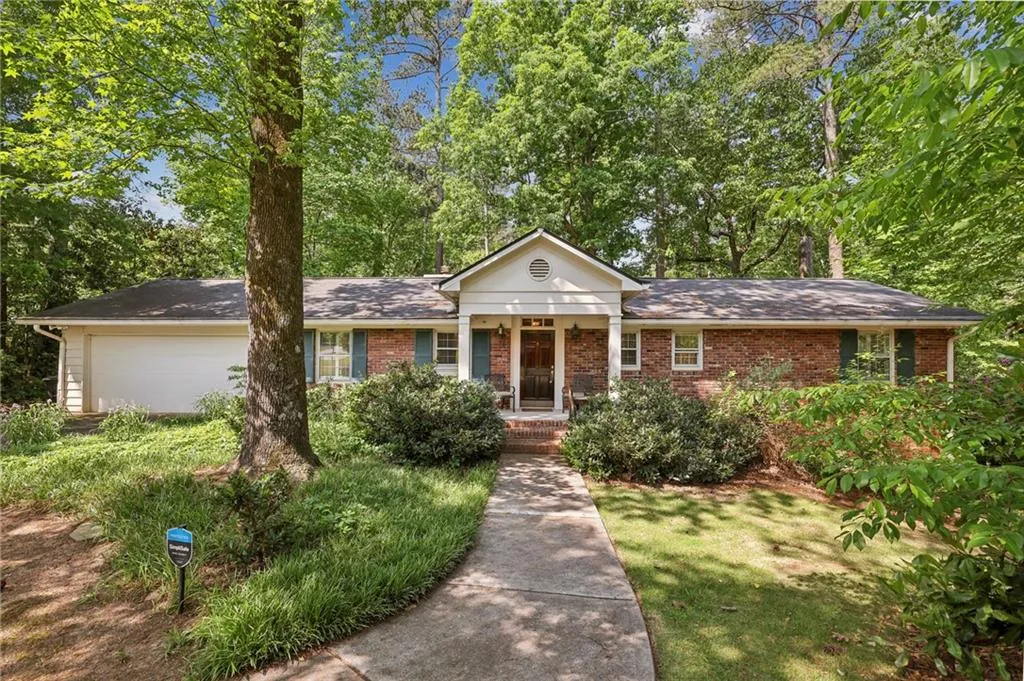 Ranch-style house featuring a front lawn