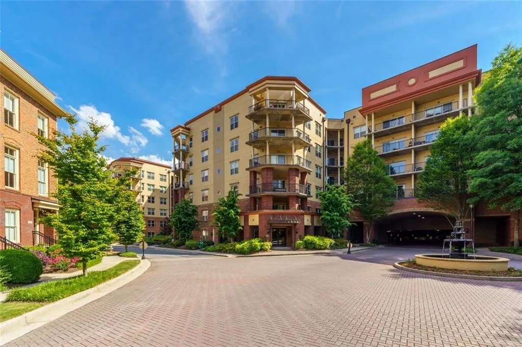 Welcome to One River Place! View of the River House from the gated entry Welcome to One River Place! View of the River House from the gated entry