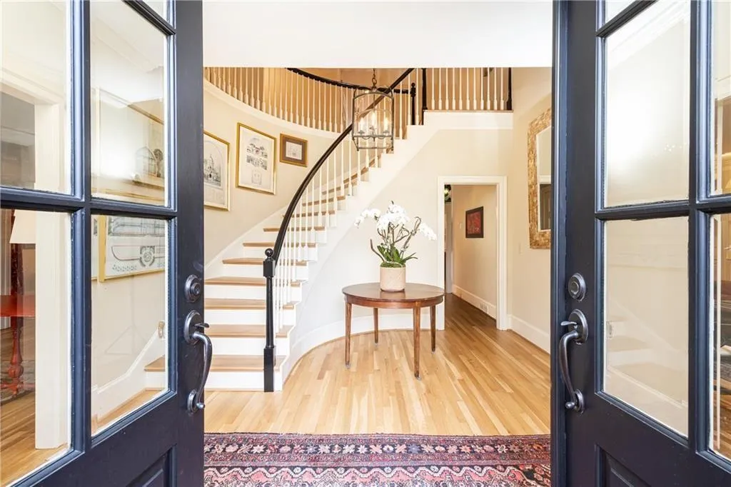 Foyer with stairs and light wood-style flooring