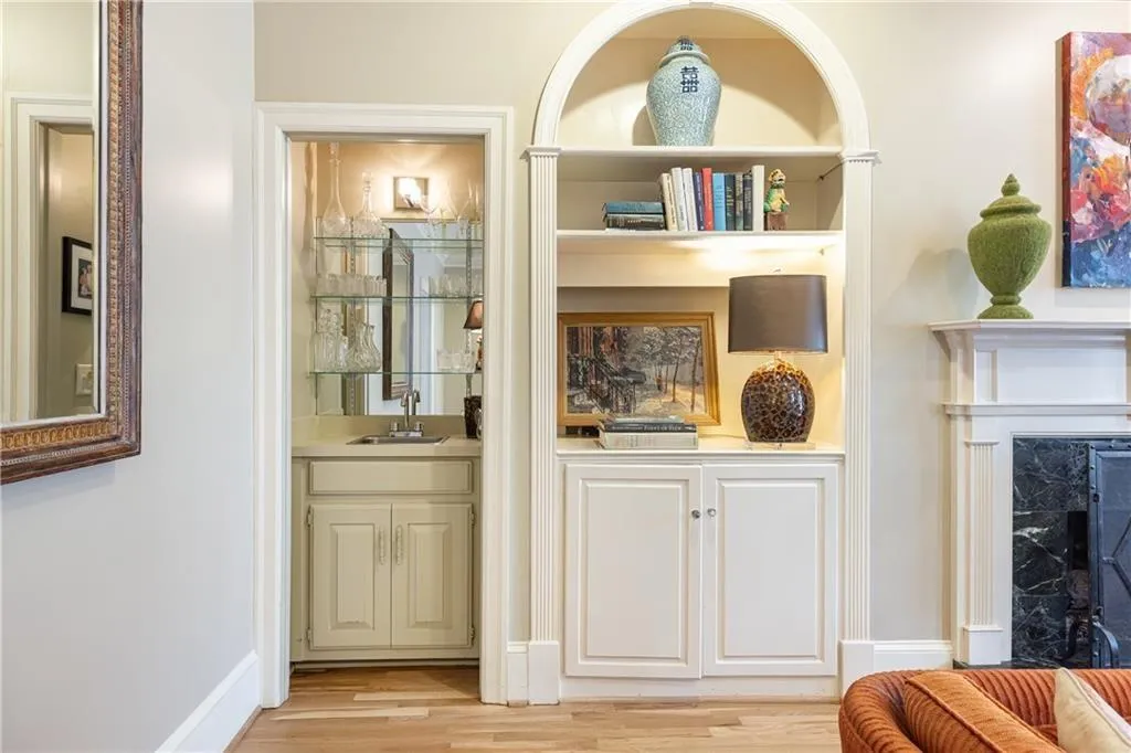 Detailed view of a high end fireplace and wood finished floors
