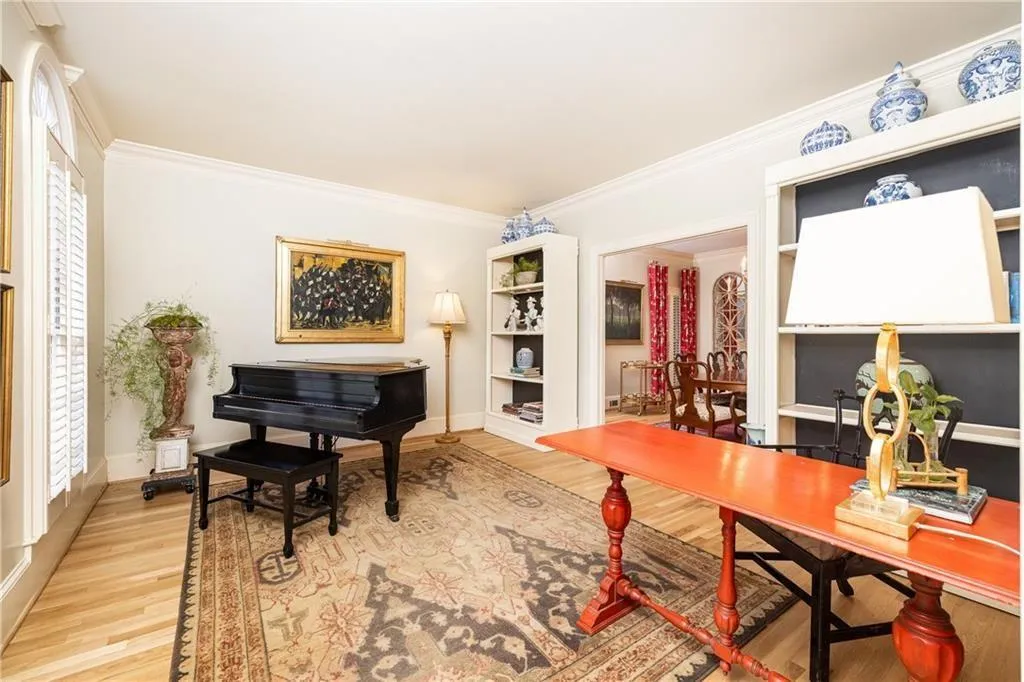 Office area featuring ornamental molding and light wood-type flooring