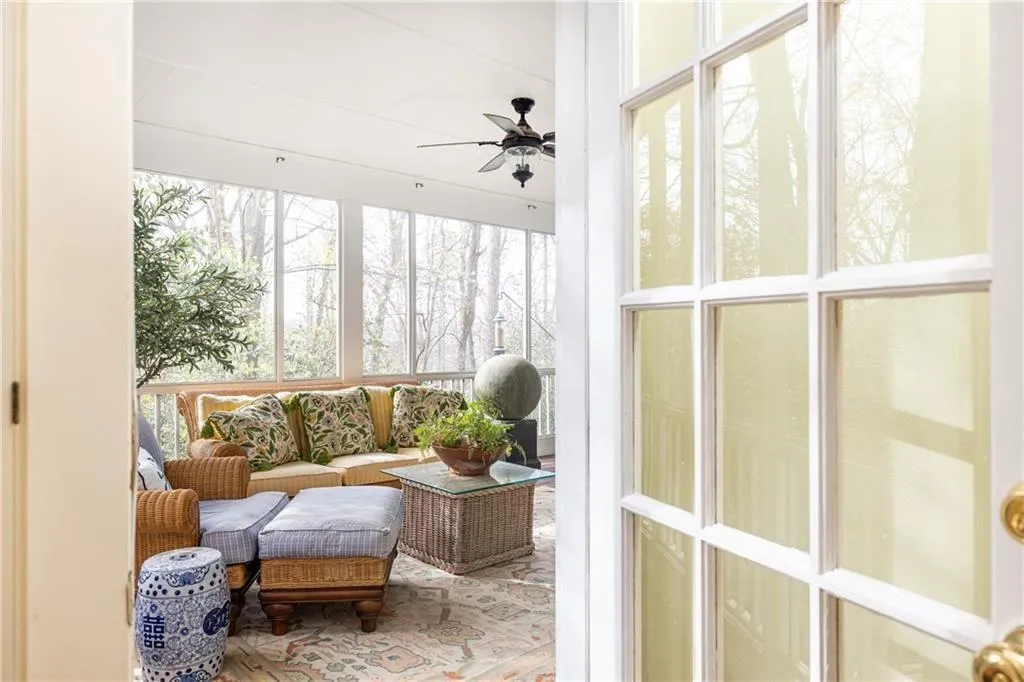 Sunroom with ceiling fan and an outdoor hangout area