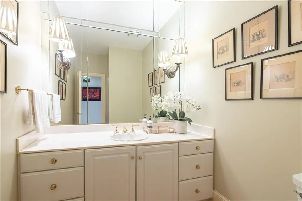 Bathroom with vanity and baseboards