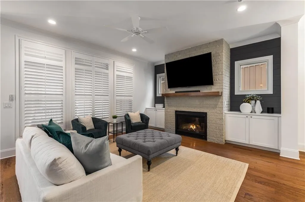Brick fire place with built-ins and plantation suters
