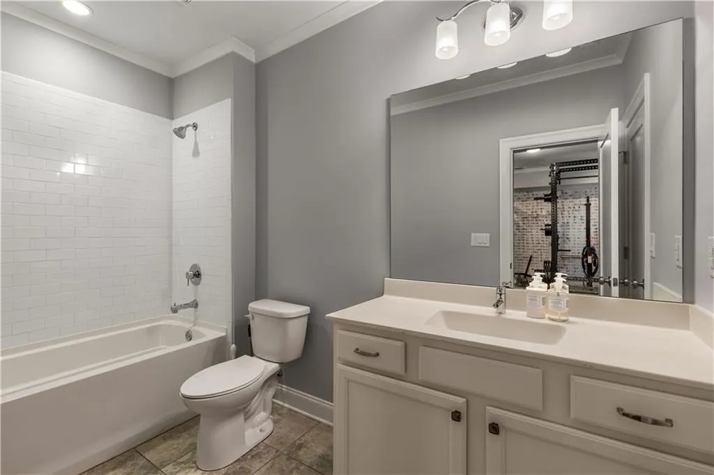 Full bathroom featuring tiled shower