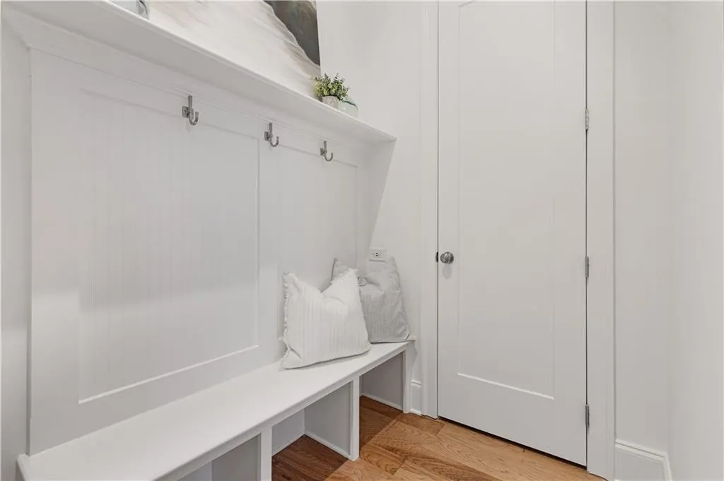 Mudroom with light hardwood / wood-style floors