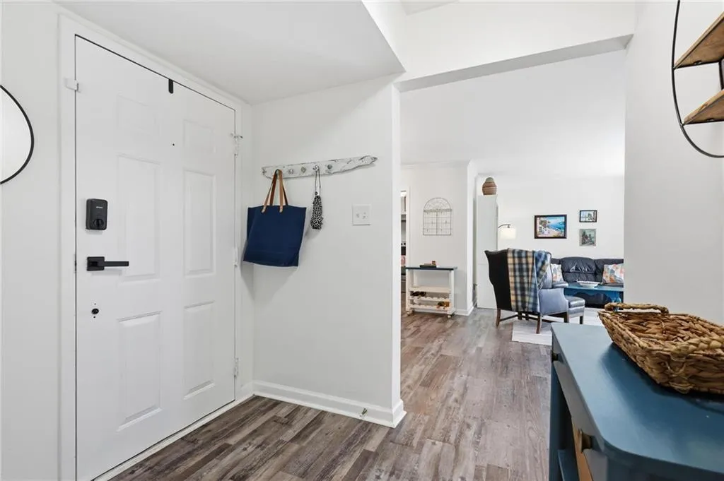 Entryway featuring wood finished floors and baseboards