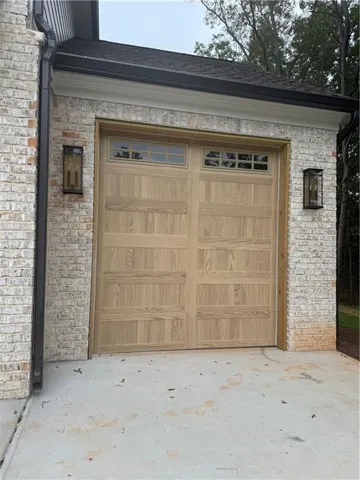 Wood-panel garage door to be installed on Friday