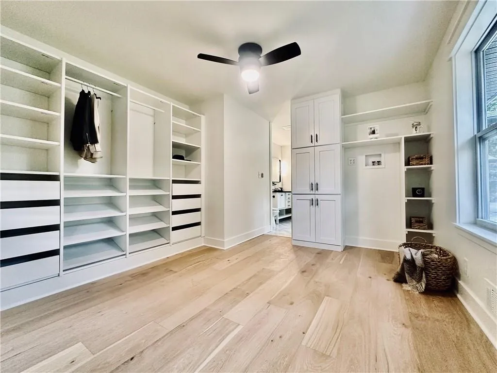 Fifth bedroom converted to a massive walk-in closet with a second laundry on the main level.