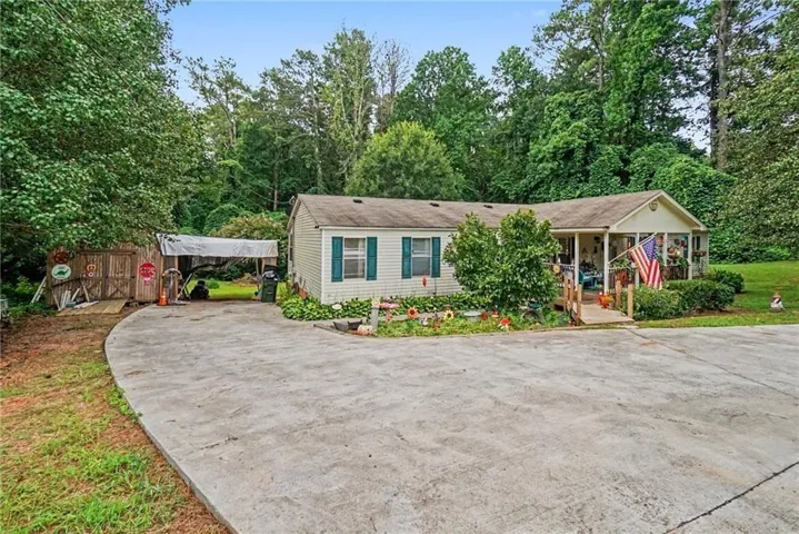 Front of home with oversized outbuilding